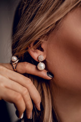 Stylish pearl earring on close up