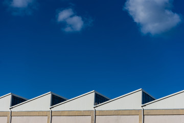 View of factory rooftops on sunny day