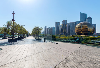 Fototapeta premium Panoramic skyline and buildings with empty concrete square floor，Qianjiang New Town，hangzhou,china