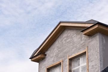 Detail of house exterior under construction.