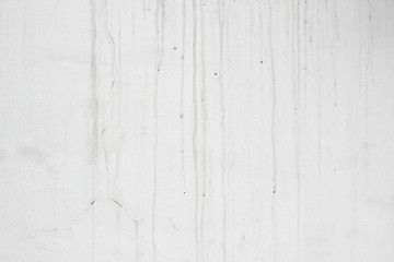 Fototapeta na wymiar Facade wall white grey gray dirty marks streaks surface close up