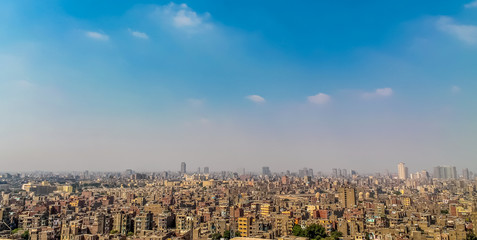 Obraz na płótnie Canvas Panorama of Cairo overflowing with cars people and waste a huge population density