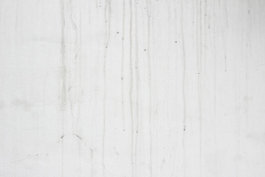 Facade wall white grey gray dirty marks streaks surface close up