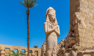 Ancient Egyptian temple Amon Ra in Luxor with columns and beautiful bas-reliefs Pharaoh's cult