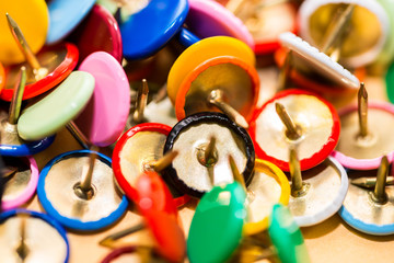 Colorful thumbtacks close up macro shot, shallow depth of field, image for background.	