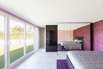 Bedroom overlooking the terrace with grass.