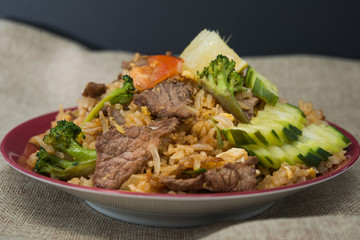 Homemade Chinese fried rice with vegetables and fried eggs