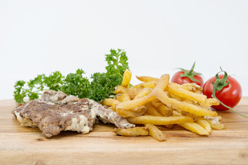 juicy steak beef meat with tomato and french fries