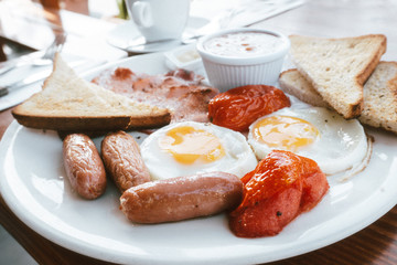 Egg and Toast - classical english breakfast with egg and ham