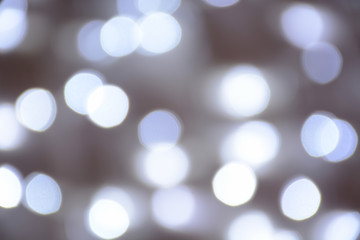 Bokeh silver blurred background. Abstract light bokeh background