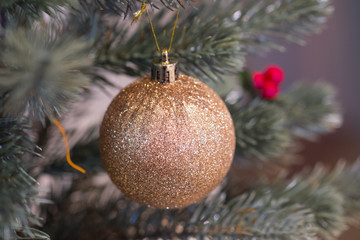 Golden christmas ornaments hanging