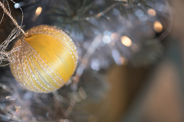 Yellow christmas ornaments with christmas lights