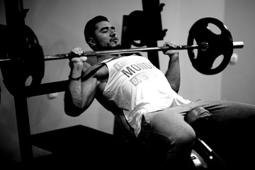 Naklejka na ściany i meble young man workout in gym 