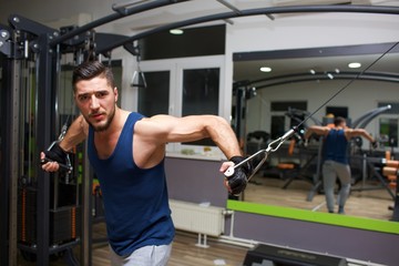 Fototapeta na wymiar young man workout in gym 