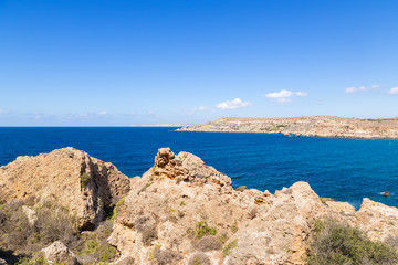 Fototapeta na wymiar Manikata, Malta. The rocky shores of Għajn Tuffieħa Bay