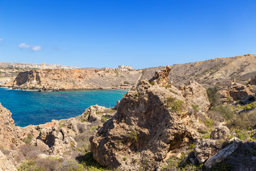 Fototapeta na wymiar Manikata, Malta. The picturesque rocky shores of Għajn Tuffieħa Bay