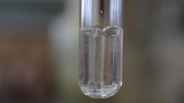 Chemical reaction in a test tube - calcium hydroxide.