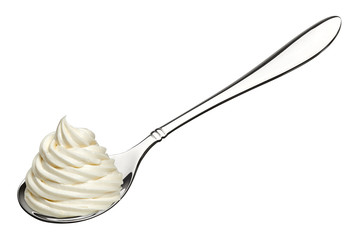 Whipped frozen yogurt or ice cream in spoon isolated on white background.