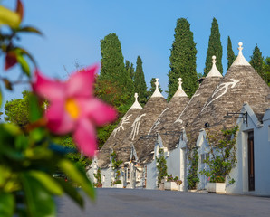 Famous houses architecture with conical roofs in Alberobello village of Trulli in Italy