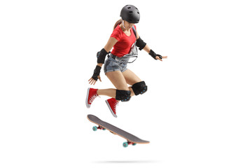 Naklejka na ściany i meble Female jumping with a skateboard