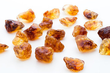 Brown caramelized sugar on white background.
