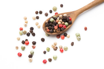 Pepper mix seed on spoon on white background.