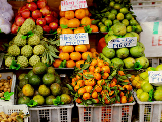 Variety of fresh fruits on a vietnamese market - obrazy, fototapety, plakaty