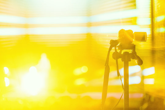 the camcorder shoots the scene with a yellow background