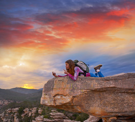 Hiker teen girl selfie phone on peak of mountain