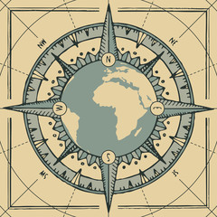 Hand-drawn vector banner with planet Earth, wind rose and old nautical compass in retro style. Illustration on the theme of travel and discovery