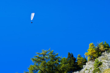 parachute in the sky mountains Switzerland