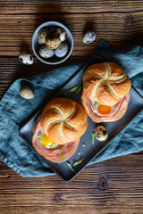 Baked rolls stuffed with ham, quail eggs and green onion