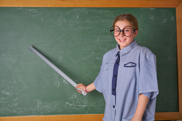 Funny kid girl at school teacher costume