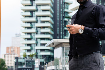 Fototapeta premium Man drinking a whiskey in Milan