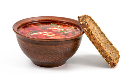 red cabbage soup with bread on a white background