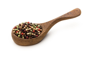 Pepper mix seed on spoon on white background.