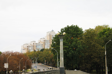 Fototapeta na wymiar The capital of the Republic of Belarus is Minsk. Yanki Kupala Street. View of the Trinity Suburb.