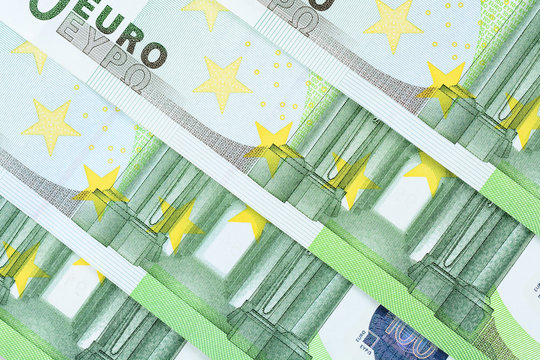 Four one hundred euro banknotes background. High resolution photo close-up macro.