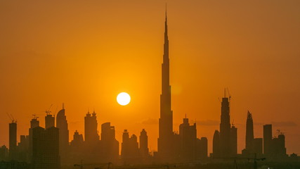 Fototapeta na wymiar Sunset with skyline of Downtown Dubai in the evening timelapse.