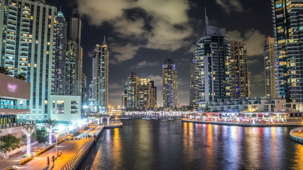 Fototapeta na wymiar View of Dubai Marina Towers and canal in Dubai night timelapse hyperlapse