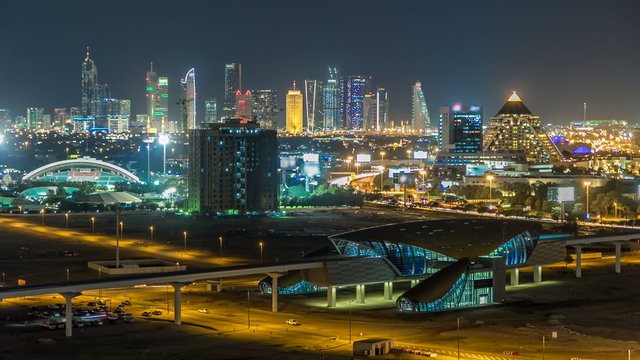 Scenic Dubai downtown skyline timelapse at night. Rooftop view of Sheikh Zayed road with numerous illuminated towers. © neiezhmakov