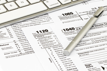The tax forms with  money and the pen. Tax Day concept
