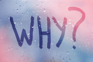 Autumn rain, the inscription on the sweaty glass - why, window with handwritten word why