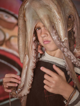 Boy with octopus on head