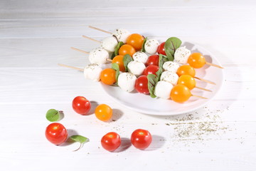 Mozzarella with cherry tomatoes on skewers