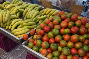 Different kind of tomatoes and bananas on street market (Guardamar del Segura, SPAIN)