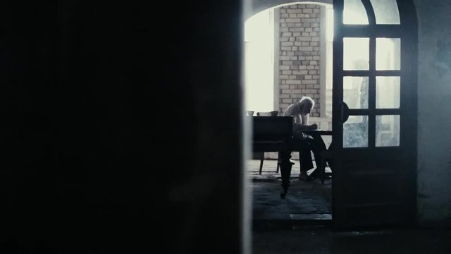Soldier of the Russian army interrogates a suspect, an elderly man with a beard, under pain of execution, signs papers, the injustice of the NKVD, cynicism of the soldiers, the cruelty of the USSR