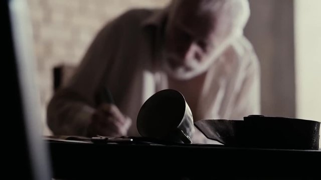 Soldier of the Russian army interrogates a suspect, an elderly man with a beard, under pain of execution, signs papers, the injustice of the NKVD, cynicism of the soldiers, the cruelty of the USSR