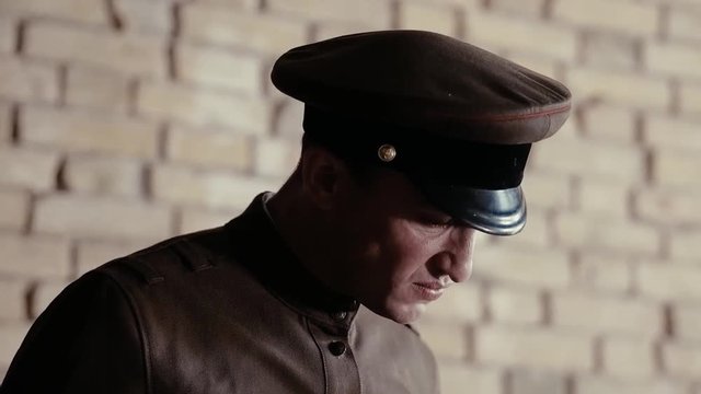 Soldier of the Russian army interrogates a suspect, an elderly man with a beard, under pain of execution, signs papers, the injustice of the NKVD, cynicism of the soldiers, the cruelty of the USSR
