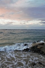 Ocean sunset with rocks and waves